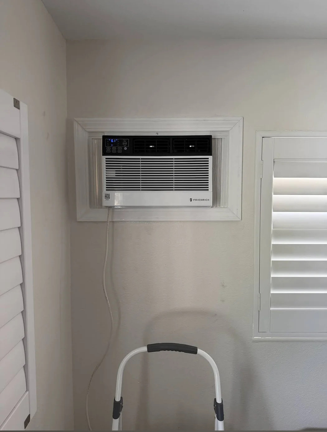 Clean Friedrich window AC installation with white custom trim